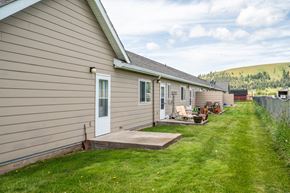 Elgin apartment for rent - A house with a brown siding and a white door is shown.