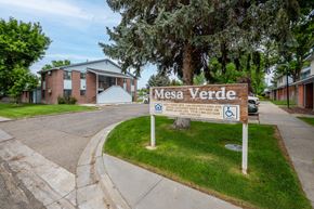 Fruitland apartment for rent - A sign for Mesa Verde in front of a building.