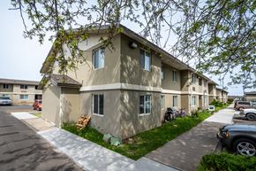 Milton-Freewater apartment for rent - a row of houses with cars parked in front of them