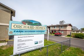 Milton-Freewater apartment for rent - a sign that reads orchard homes farm worker housing with a building in the background
