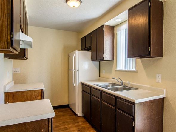 Hermiston apartment for rent - a kitchen with a sink and a refrigerator