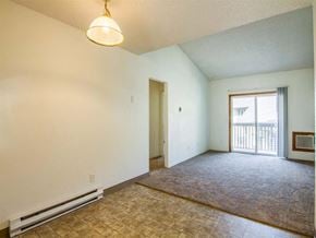 Milton-Freewater apartment for rent - an empty living room with a door to a balcony