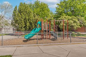 Redmond apartment for rent - a playground with a slide at a park