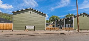 Gold Hill apartment for rent - a green building with a sign in front of it on a street