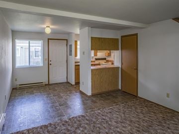 Chewelah apartment for rent - a kitchen and a living room with an empty floor
