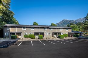 Cascade Locks apartment for rent - A large building with a parking lot in front of it.