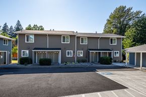 Cascade Locks apartment for rent - A row of houses with a driveway in front.