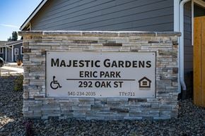 Junction City apartment for rent - A sign for Majestic Gardens Eric Park with a wheelchair symbol indicating it is handicap accessible.