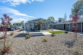 Junction City apartment for rent - A building with a gravel driveway in front of it.