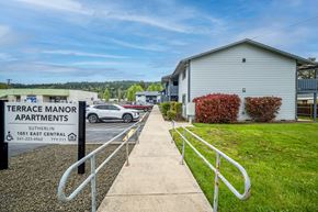 Sutherlin apartment for rent - Terrace Manor Apartments is a place with apartments and a car parked in front.
