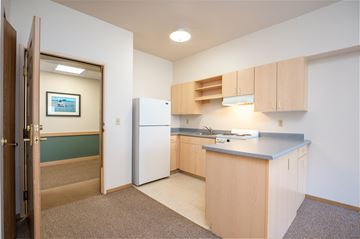 Portland apartment for rent - a small kitchen with a white refrigerator and a counter top