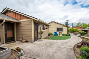 Salem apartment for rent - a row of houses with a driveway and a yard