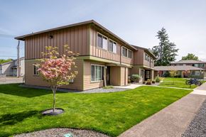 Molalla apartment for rent - a house with a lawn and a tree in front of it