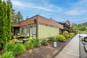 Sherwood apartment for rent - a green house with a sidewalk and plants in front of it