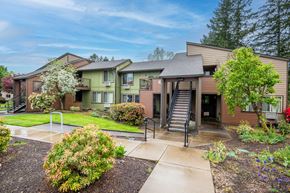 Sherwood apartment for rent - a building with stairs and a sidewalk in front of it