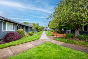 Newberg apartment for rent - a sidewalk in front of a row of houses