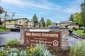 Dundee apartment for rent - the sign for dorcas country apartments in front of a parking lot