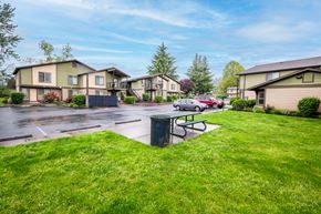 Dundee apartment for rent - a city street with houses and a picnic table
