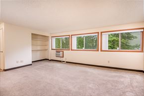 St.Helens apartment for rent - the living room of a home with a carpeted floor and windows