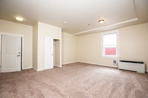 The Dalles apartment for rent - an empty living room with carpet and a window