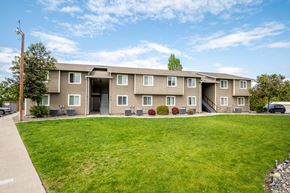 Boardman apartment for rent - the view of an apartment building with a green lawn