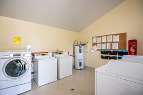 Boardman apartment for rent - a laundry room with washers and dryers and a row of washing machines