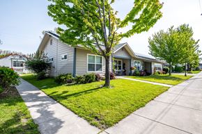 Athena apartment for rent - a house with a lawn and trees in front of it
