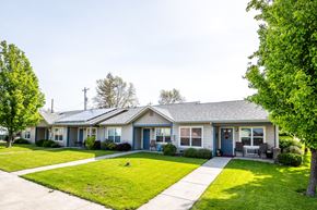 Athena apartment for rent - a house with a lawn and a sidewalk in front of it