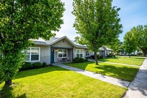 Athena apartment for rent - a house with a sidewalk and trees in front of it