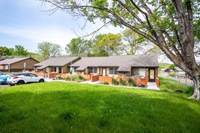 Milton-Freewater apartment for rent - a house with a yard and a parking lot