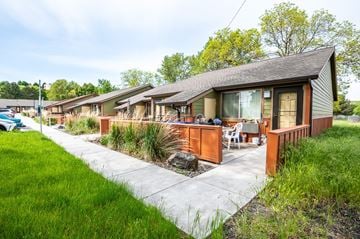 Milton-Freewater apartment for rent - a row of bungalows with a sidewalk and grass