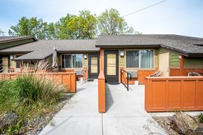 Milton-Freewater apartment for rent - the front of a house with a concrete walkway and a deck with a patio