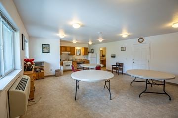 Island City apartment for rent - a living room with a table and a kitchen