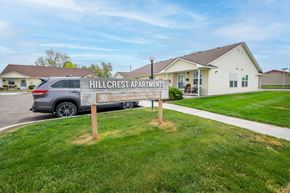 Ontario apartment for rent - the hillcrest apartments sign in front of a house