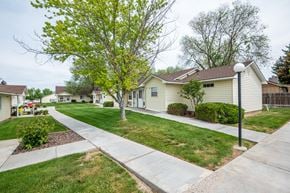 Ontario apartment for rent - a street with white houses and trees and a sidewalk