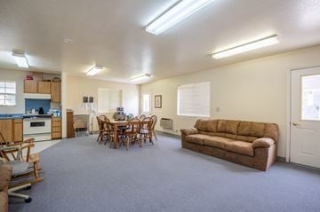 Ontario apartment for rent - a living room and dining room with a couch and a table
