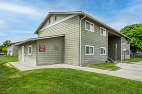 Ontario apartment for rent - a green house with a sign on the side of it