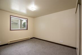 Ontario apartment for rent - the living room of a home with a carpeted floor and a window