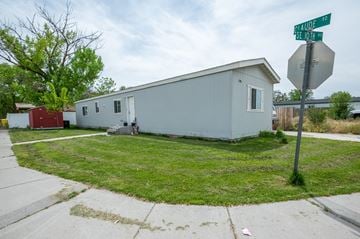 Ontario apartment for rent - a small white house with a street sign in front of it