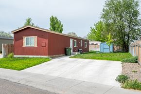Ontario apartment for rent - a red house with a driveway in front of it