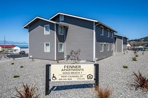 Gold Beach apartment for rent - A sign in front of a building that says "Fennner Apartments Gold Beach 1".