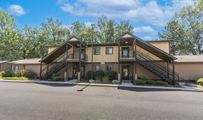 Phoenix apartment for rent - the front of a house with stairs and a parking lot