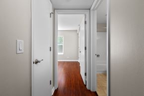 Arlington Heights apartment for rent - a bedroom with a door open to a hallway with a hard wood floor
