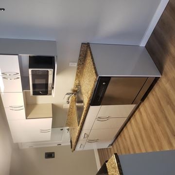 Seattle apartment for rent - A kitchen with a microwave built into the cabinetry.