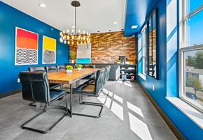 Minneapolis apartment for rent - a dining room with blue walls and a wooden table and chairs