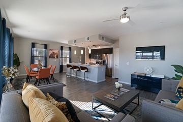 Phoenix apartment for rent - a living room and kitchen with a couch and a table