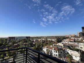 Phoenix apartment for rent - a balcony with a view of the city and palm trees