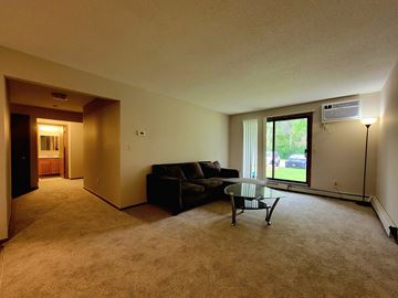 Eagan apartment for rent - a living room with a couch and a glass coffee table