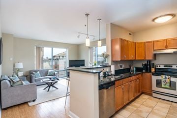 South Boston apartment for rent - a kitchen with an island and a living room with a couch