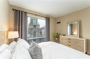 South Boston apartment for rent - 50 WB's furnished apartment showing a bedroom with a bed and a view of a church